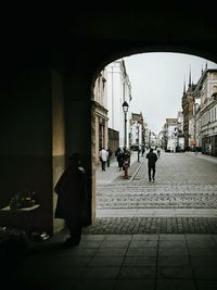 Man and woman walking in city