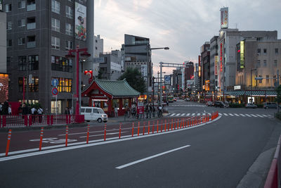 City street and buildings against sky