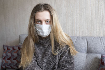 Portrait of young woman wearing hat