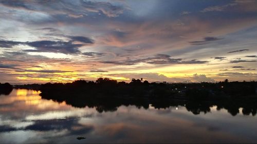 Scenic view of lake against sky during sunset