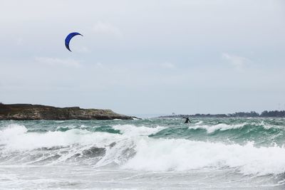 Man kiteboarding in sea