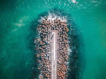 High angle view of stones in sea