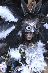 High angle view of feathers in mask