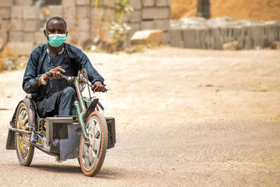 Man sitting on road