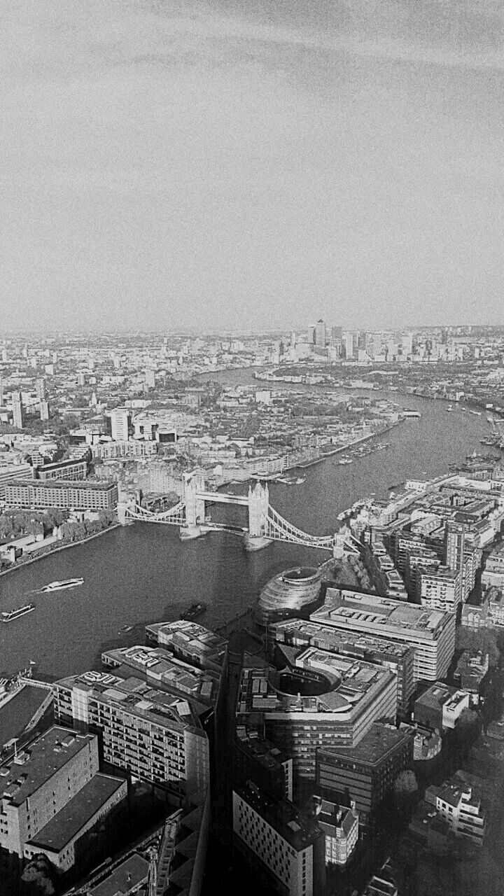 HIGH ANGLE VIEW OF CITY AT WATERFRONT