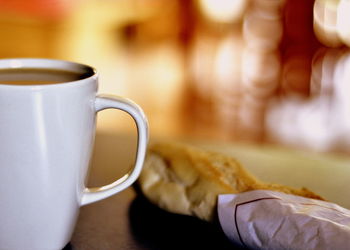 Close-up of coffee cup on table