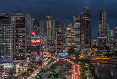 Aerial view of city lit up at night