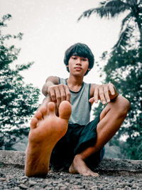 Portrait of young man sitting outdoors