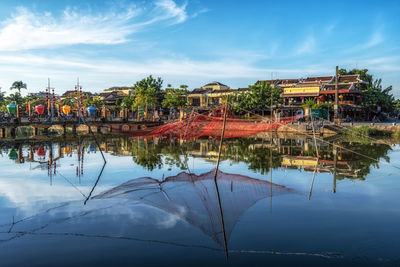 Thu bon river and an hoi town reflection taken from hoi an ancient town river bank.