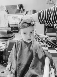 Toddler boy getting a haircut 