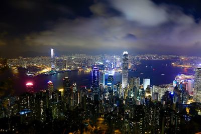 Aerial view of city lit up at night