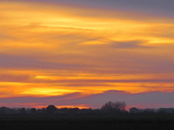 Scenic view of dramatic sky during sunset