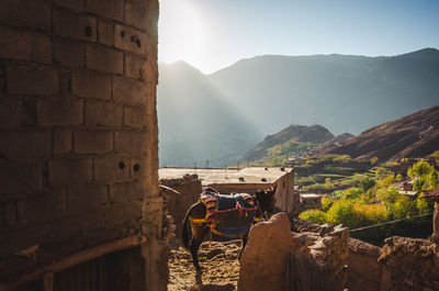 View of buildings against mountain range