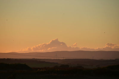 Scenic view of landscape at sunset