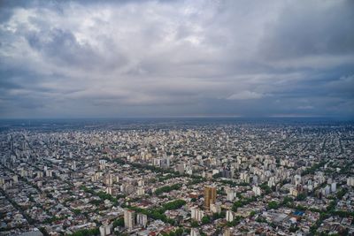 High angle view of city buildings against sky