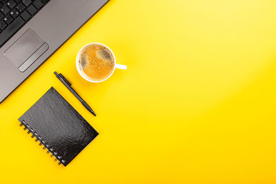 High angle view of coffee cup on table