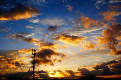 Low angle view of cloudy sky at sunset