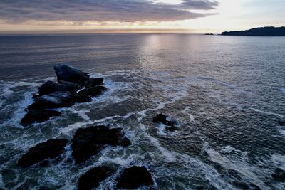Scenic view of sea against sky during sunset