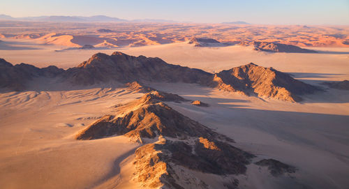 Scenic view of mountains against sky during sunset