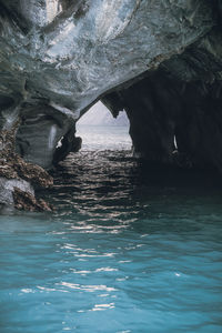 Scenic view of sea seen through cave