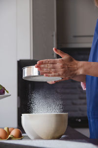 Midsection of man preparing food on table