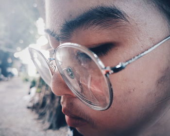 Close-up portrait of man wearing eyeglasses