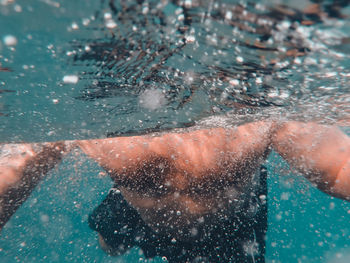 Man swimming in pool