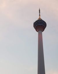 Low angle view of communications tower against sky