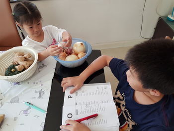High angle view of people holding food