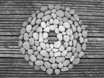 High angle view of stones arranged on wooden table