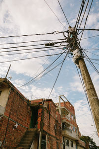 Low angle view of abandoned buildings against sky