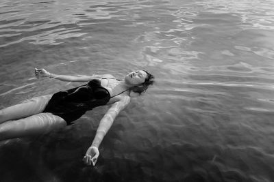 High angle view of woman swimming in pool