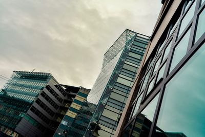 Low angle view of modern buildings against sky