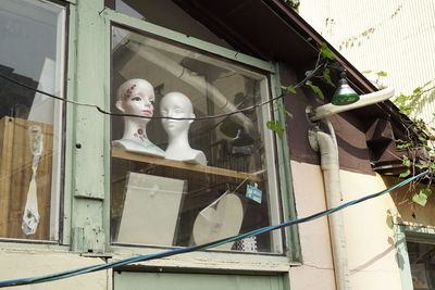 Low angle view of statues on abandoned building