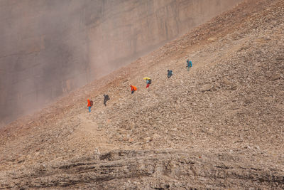 High angle view of people walking on road