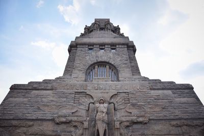 Low angle view monument to the battle of the nations against sky