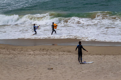 People playing on beach