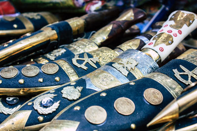 High angle view of coins on metal