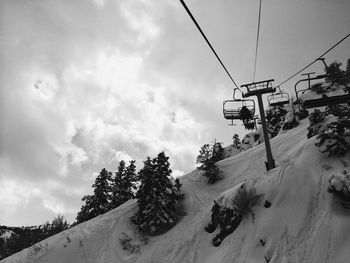 Low angle view of ski lift against sky