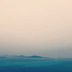 Scenic view of sea against clear sky during sunset