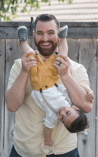 Portrait of happy man photographing