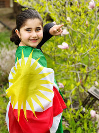 Portrait of a girl with the flag of kurdistan