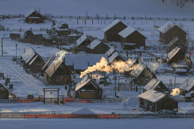 Houses against sky during winter