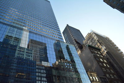 Low angle view of skyscrapers against clear sky