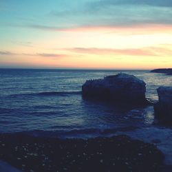 Scenic view of sea against sky at sunset