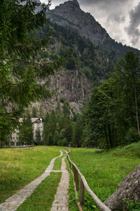 Dirt road passing through mountains