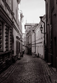 Street amidst buildings in city against sky