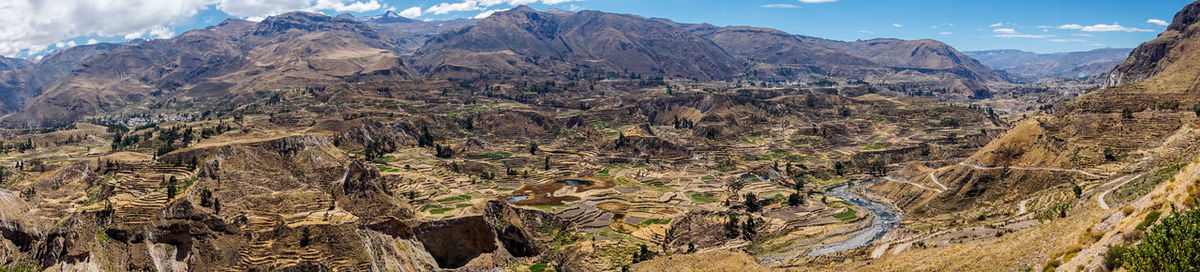 Panoramic view of rocky mountains against sky