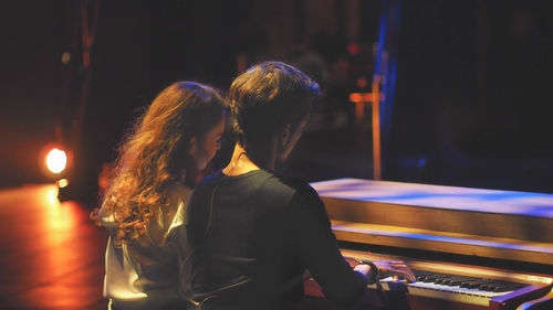 Musicians playing piano at music concert