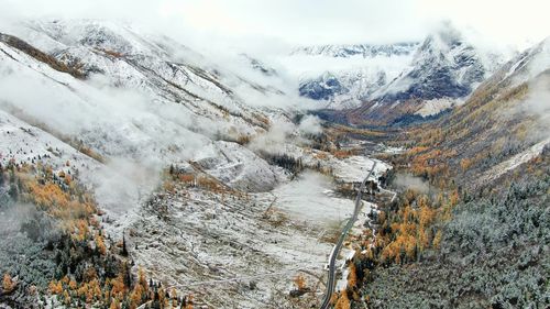 High angle view of snowcapped mountains during winter